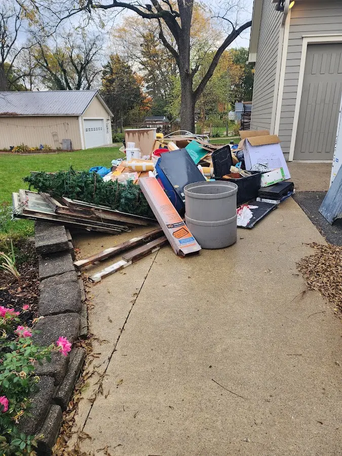 Dumpster being loaded with debris for 30 Yard Dumpster Rental in Byram